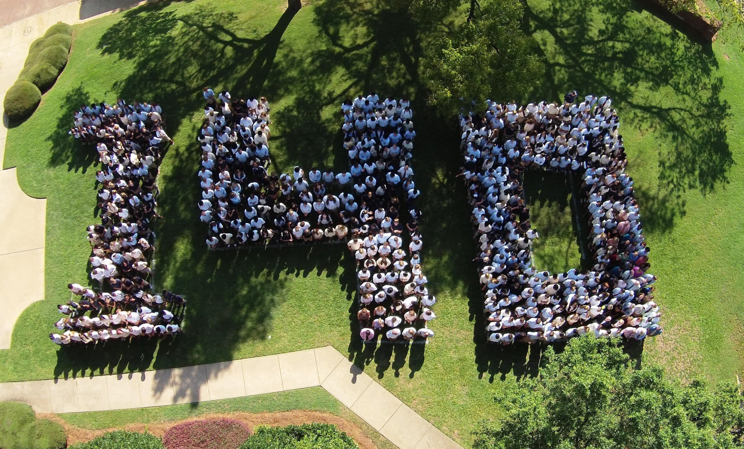 Students, faculty, and staff form